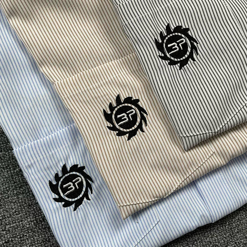Broken Planet, a niche European and American fashion brand, features summer letter logos embroidered with loose stripes and short sleeved shirts