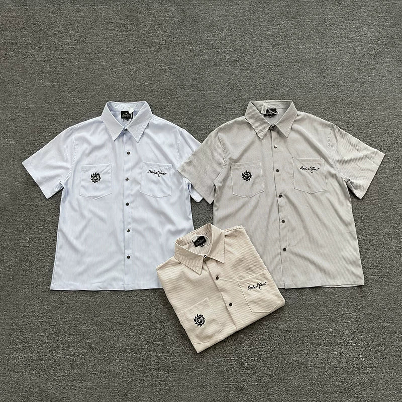 Broken Planet, a niche European and American fashion brand, features summer letter logos embroidered with loose stripes and short sleeved shirts