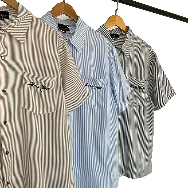 Broken Planet, a niche European and American fashion brand, features summer letter logos embroidered with loose stripes and short sleeved shirts